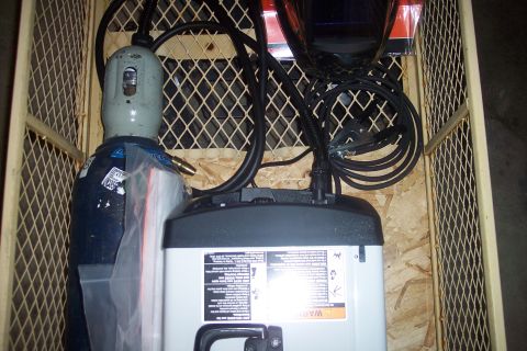 1995 Ford Bronco - This crate contains welding equipment, including a gas cylinder, a welding machine, and a helmet.