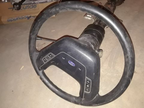 1994 Ford Bronco - This steering wheel features the Ford logo and cruise control buttons, suggesting it's from a 1990s era Ford vehicle.