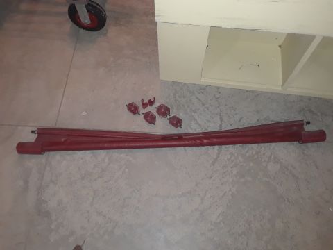 1994 Ford Bronco - This appears to be a car part, possibly a trim piece, along with several clips.