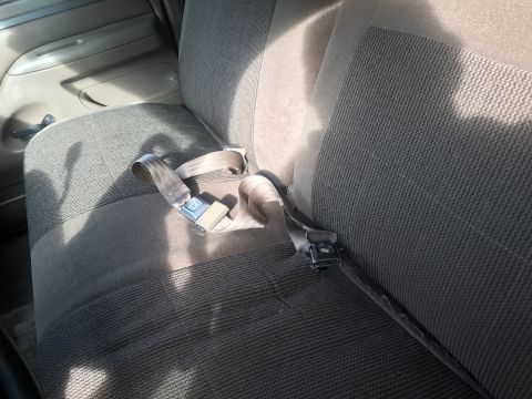 1994 Ford Bronco - Interior view of car seats with seatbelts fastened.