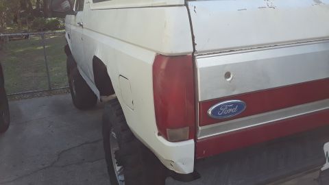 1994 Ford Bronco - Rear view of a Ford Bronco, showing its distinctive body style and trim details.