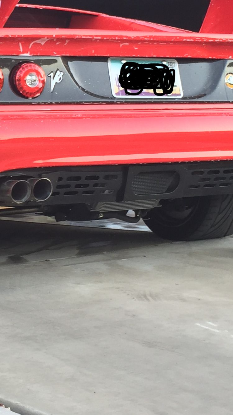 2000 Lotus Esprit rear bumper with dual exhaust pipes and V8 badge