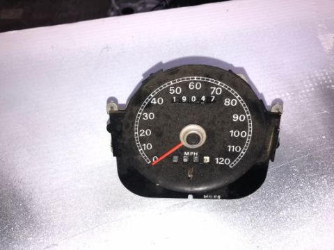 1979 Ford Ranchero - A close-up of a vintage car speedometer with a reading of 19047. The speedometer is black with white markings and a red needle.