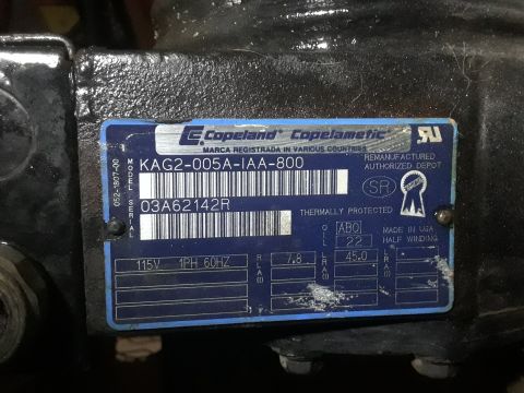 1994 Ford Bronco - A close-up of a Copeland compressor nameplate with a barcode and technical specifications. The plate is blue and white and shows model and…