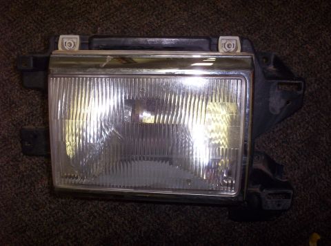 1988 Ford Bronco - This is a single headlight assembly, not a full vehicle.