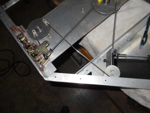 1992 Ford Bronco - This is a close-up shot of a mechanical assembly with cables, pulleys, and a latch mechanism, likely part of a custom build or modification…