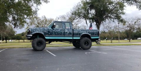1979 Ford Ranchero - Custom lifted pickup truck with unique paint job and large tires.