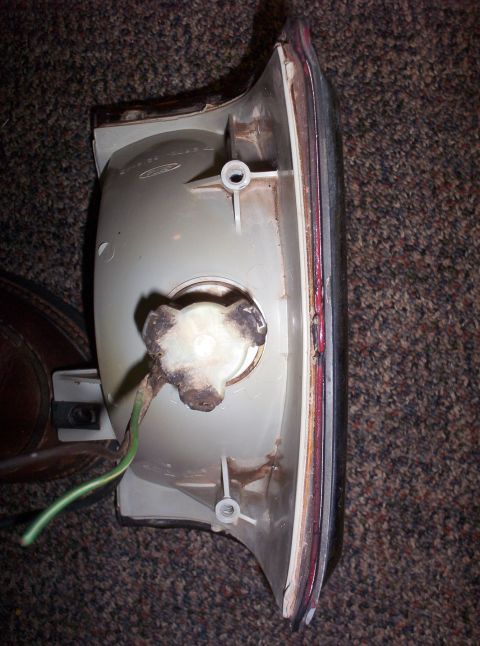 1988 Ford Bronco - Rear tail light assembly, likely for a truck or SUV, shown from the back with its wiring harness.