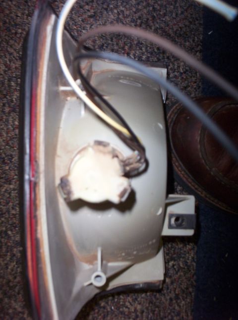 1988 Ford Bronco - Tail light assembly with wires, likely for a Ford Bronco, viewed from the rear.