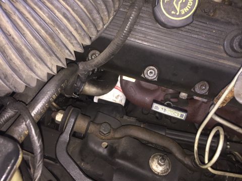1994 Ford Crown Victoria - A view of the engine bay with various components visible, including an oil filter and engine oil dipstick.