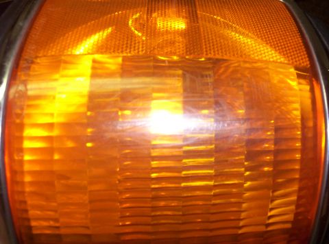 1988 Ford Bronco - This close-up shows the textured lens of an orange turn signal, a common automotive part.