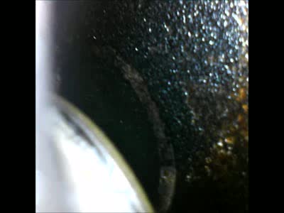 1996 Ford Bronco - using a inspection camera through a spark plug hole, you can see the valve still stuck open and the mark on the piston it caused