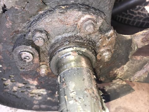 1994 Ford Bronco - This image shows a heavily corroded wheel hub assembly, likely in need of repair or replacement.