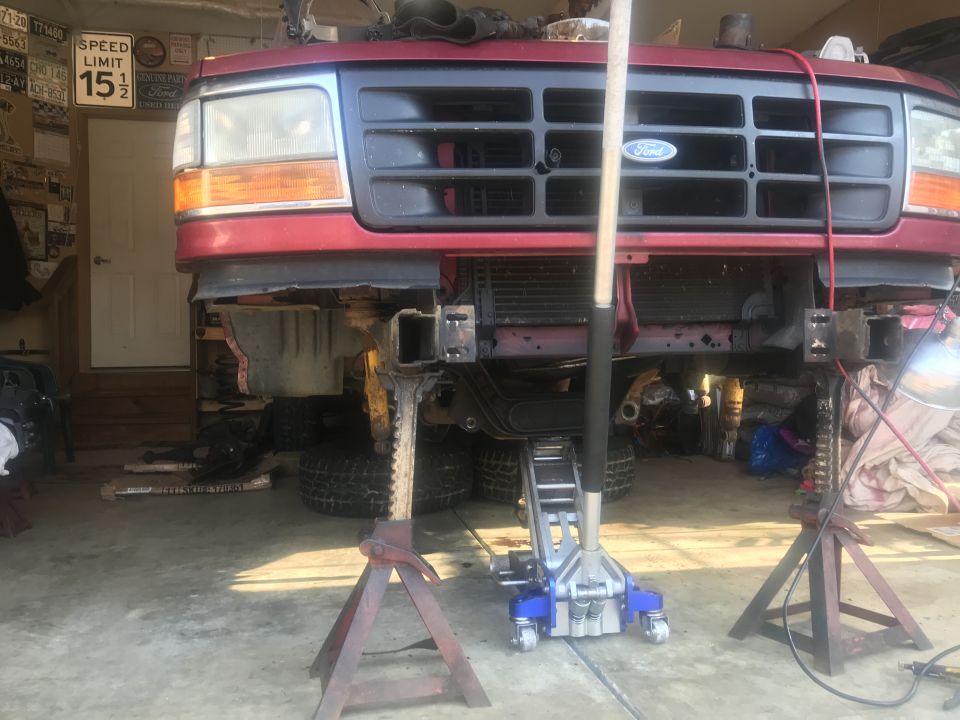 1994 Ford Bronco front end disassembled on jack stands