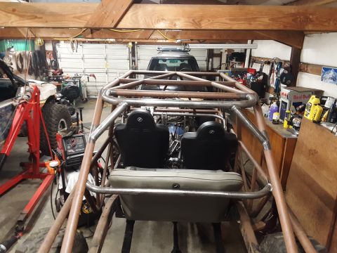 1985 Toyota Hilux - Custom tube chassis buggy interior under construction, with another vehicle in the background.