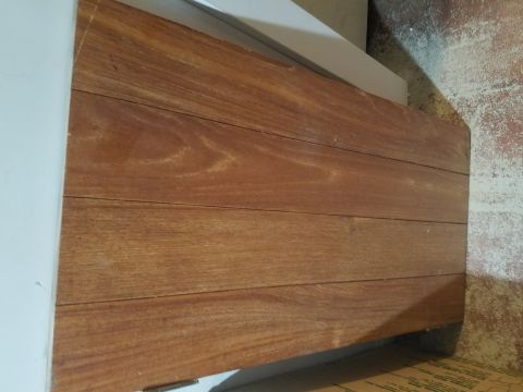 1990 Ford Bronco - A close-up view of several wooden planks, possibly part of a structure or furniture.