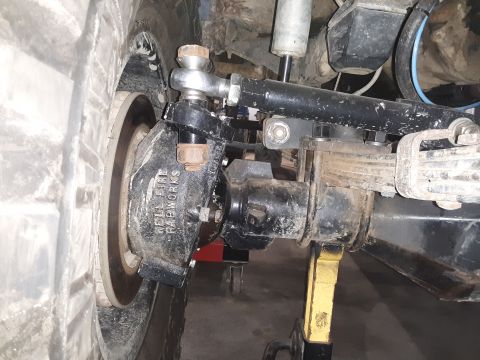 1985 Toyota Hilux - Custom suspension component labeled "HELL FIRE FABWORKS" is shown in detail.