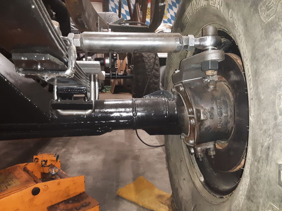 close-up of rear axle, leaf springs, and shock absorber assembly