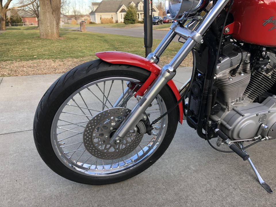 2002 Harley-Davidson Sportster Custom front wheel, brake disc, and engine detail