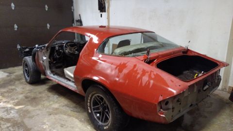 1979 Chevrolet Camaro - This 1979 Chevrolet Camaro is in a garage, appearing to be undergoing restoration work.