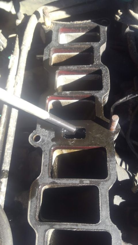 1996 Ford Bronco - pulled the upper intake. my Trickflow intake has internal EGR passage but some reason the passage was completely full of oil. no idea why o…