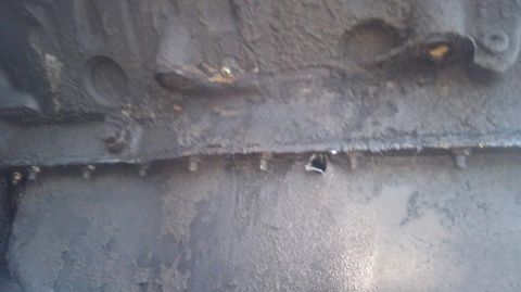 1996 Ford Bronco - pulled the engine. not good finding a spot on each side of the oil pan with a hole in it