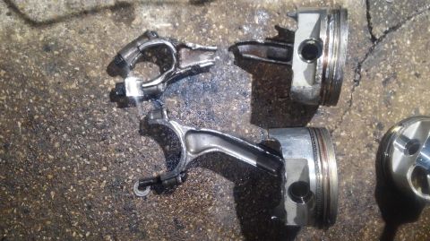 1996 Ford Bronco - number 2 and 6 pistons. 2 with a snapped rod, 6 with the bent rod. the bottom the the cap on 2 broke away, the nuts were still in place. di…