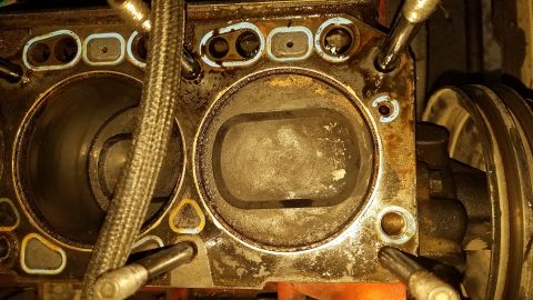 1985 Ford Bronco - This image shows the internal components of an engine's cylinder block, likely during a repair or rebuild process.