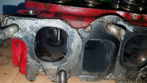 1985 Ford Bronco - This image shows a close-up view of an engine cylinder head, focusing on its intake and exhaust ports.