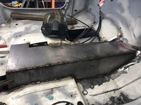 1992 Jeep Wrangler - Welding a patch into the floor pan of a vehicle's interior. A helmet is visible.