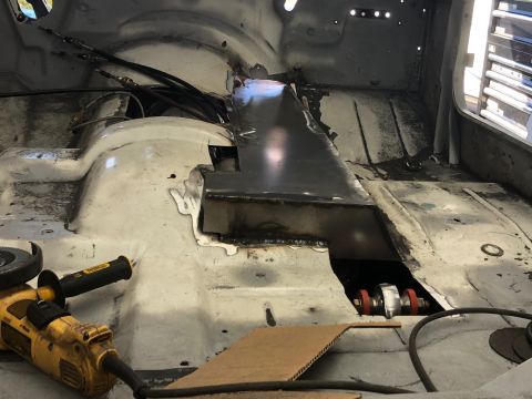 1992 Jeep Wrangler - The interior of a vehicle shows extensive bodywork and repair with tools present.