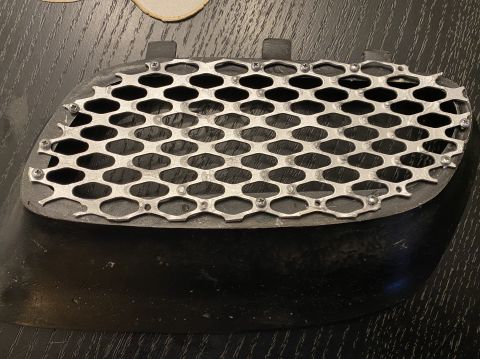 2000 Pontiac Grand Prix - A custom grille insert with a hexagonal mesh pattern is shown, likely a replacement part for a vehicle.