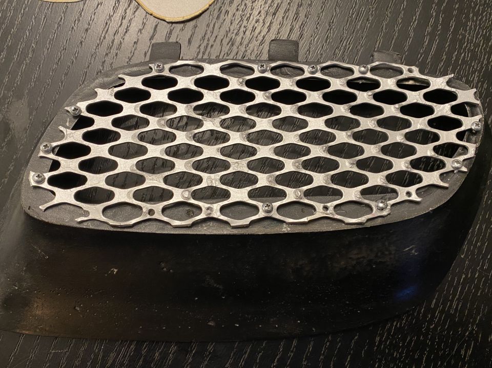 Custom grille insert with hexagonal mesh pattern
