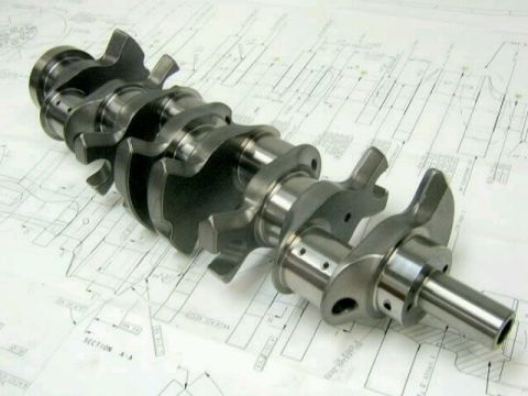 2019 Ford Mustang - Engine crankshaft shown on top of detailed technical blueprints.