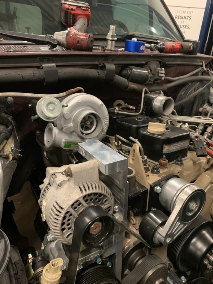 20200102 - Received and installed the center dump exhaust manifold. Bolting it up to bottom dump wouldn't clear the high mount AC kit. Bolting it top mount fit perfecting under the hood and gives plenty of space for the downpipe.