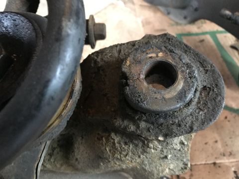 1994 Ford Bronco - This image shows a heavily corroded suspension part, indicating significant wear and tear.