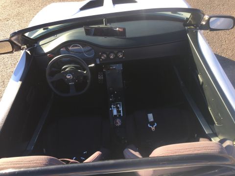 2015 Subaru Impreza - Interior view of a car with a racing steering wheel and dashboard.