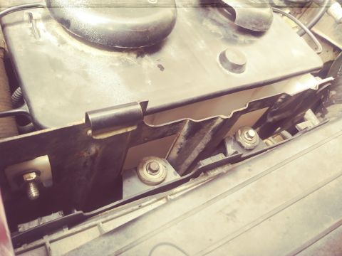 1996 Ford Bronco - The image shows a close-up view of a vehicle's air intake system components and fasteners.