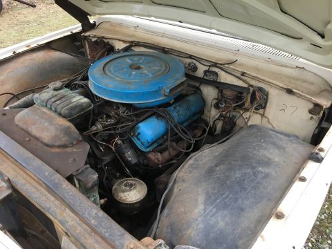 1960 Ford Starliner - Engine bay details showing the air cleaner, valve covers, and radiator hoses.