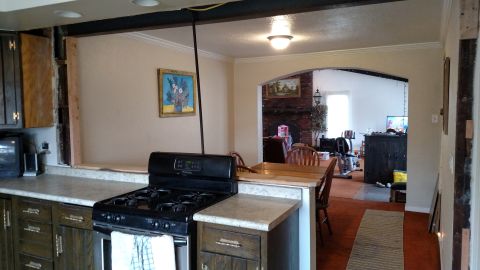 1980 Yugo Vega - Interior view of a home undergoing renovation, showing a kitchen and adjacent rooms.