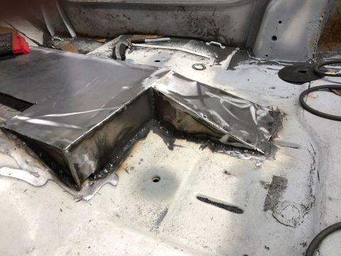 1992 Jeep Wrangler - Custom metal fabrication is being done on the interior floor of a vehicle.