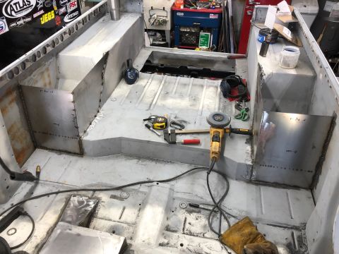 1992 Jeep Wrangler - Interior of a Jeep undergoing body work with welding and metal fabrication visible.