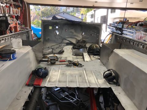 1992 Jeep Wrangler - This Jeep CJ-7 is undergoing extensive bodywork, with its interior completely disassembled and tools laid out.