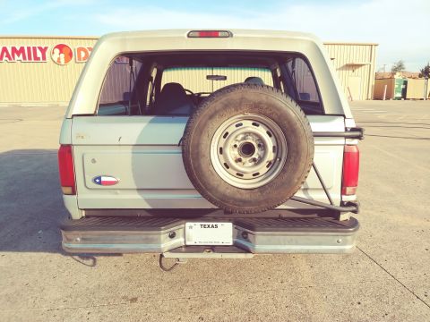 1996 Ford Bronco - This 1992 Ford Bronco is seen from the rear, a spare tire and Texas license plate.