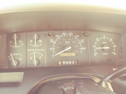 1996 Ford Bronco - Interior view of a vehicle's dashboard gauges, including a speedometer and odometer.