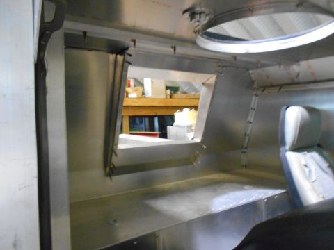1992 Ford Bronco - The interior of this vehicle appears to be under construction, with exposed metal panels and a basic seat visible.