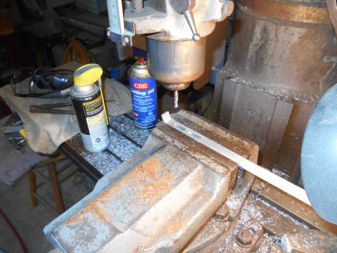 1992 Ford Bronco - A milling machine is used to cut metal stock, with CRC cutting oil applied.