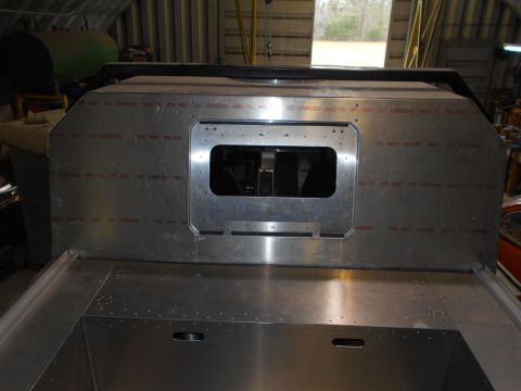 1992 Ford Bronco - This aluminum panel features a central rectangular cutout and is covered in red stamped text, indicating it is a manufactured part.