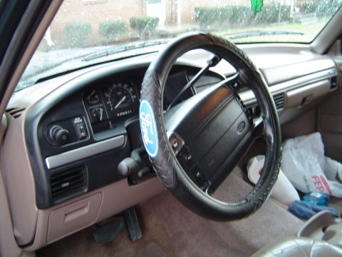 1994 Ford Bronco - Interior view of a 1994 Ford Bronco, highlighting the dashboard and steering wheel.