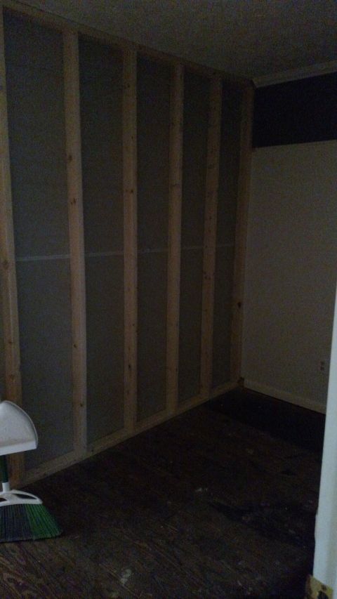 1980 Yugo Vega - Room framing in progress with a broom and dustpan in the corner.